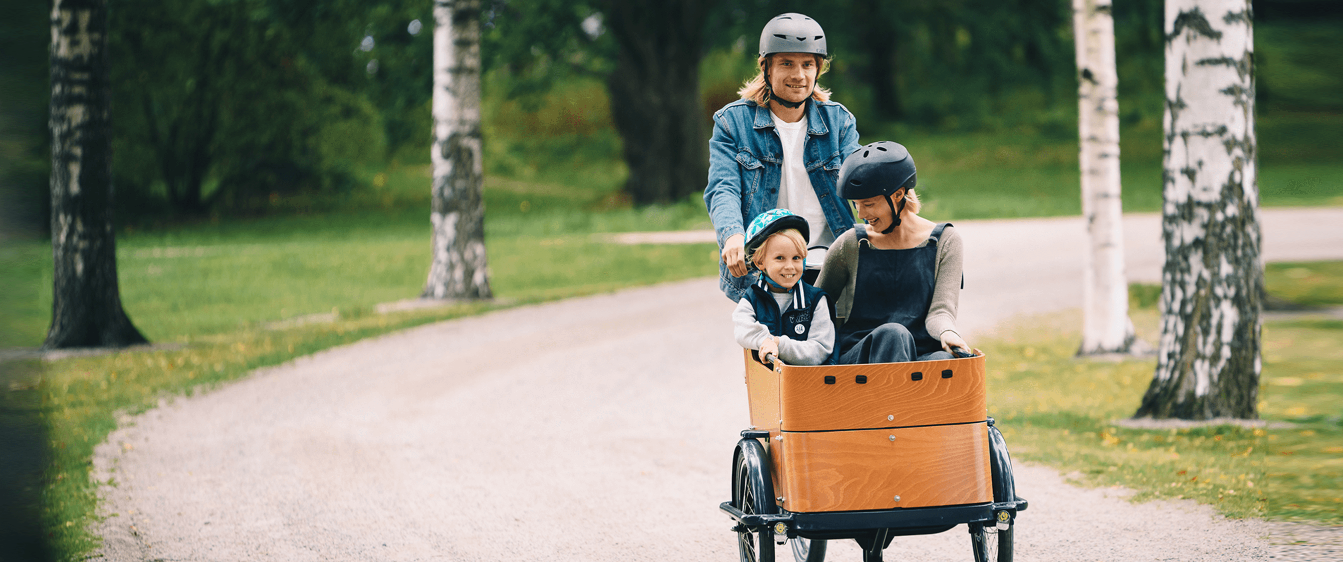 Family having fun in a park on a bike.