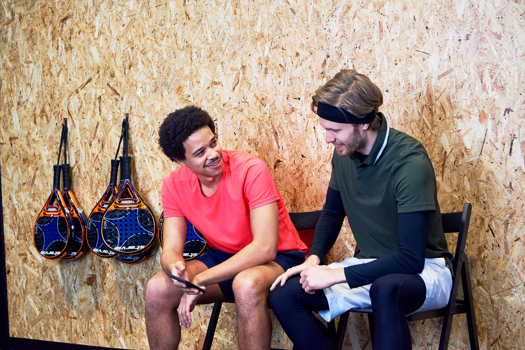 Two boys chit-chatting after workout
